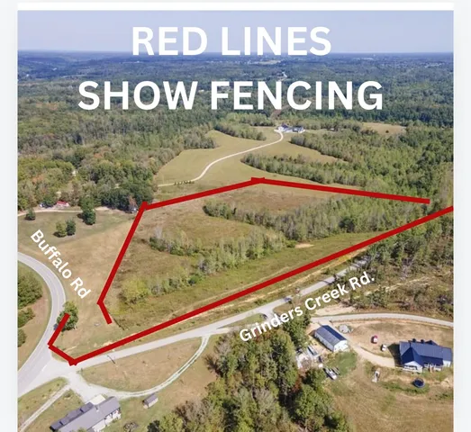 a sign broad in front of the green space