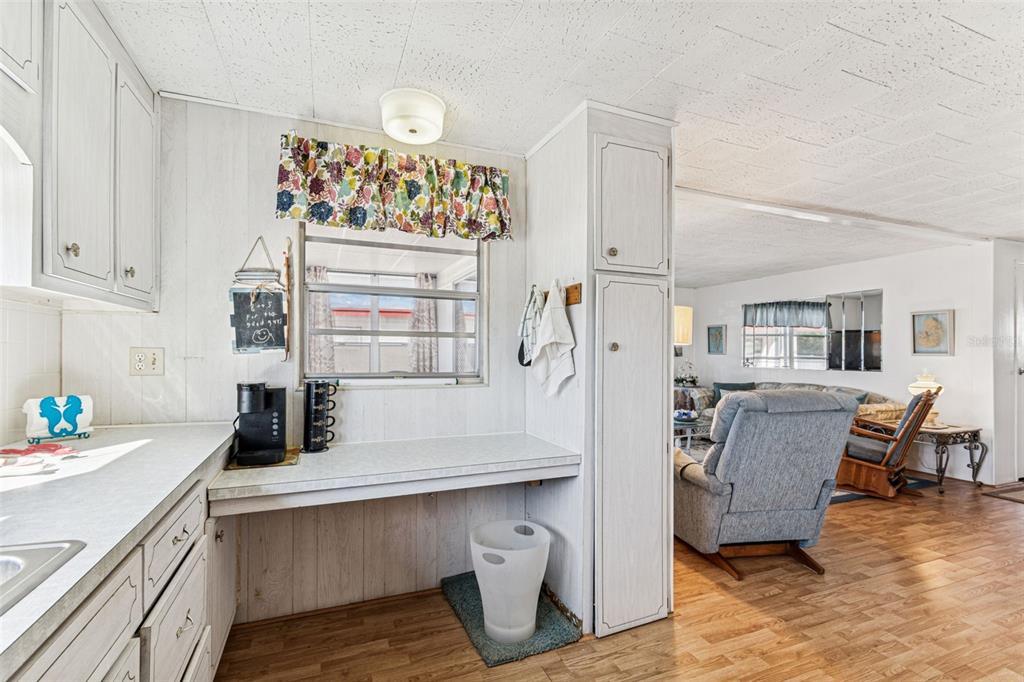 13225 101st Street Southeast, Unit 222 Largo, FL 33773 - Photo 21 of 73 a kitchen with refrigerator and cabinets