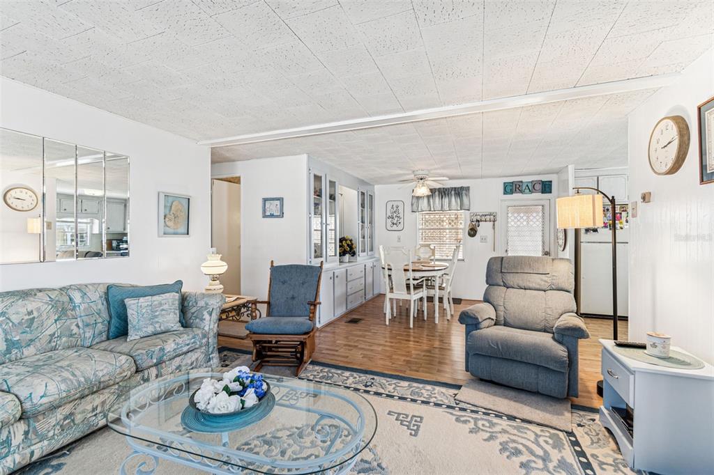 13225 101st Street Southeast, Unit 222 Largo, FL 33773 - Photo 22 of 73 a living room with furniture and wooden floor