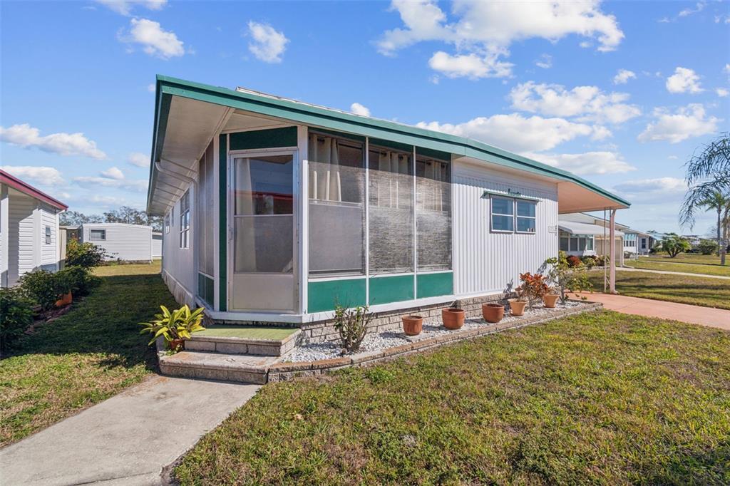 13225 101st Street Southeast, Unit 222 Largo, FL 33773 - Photo 3 of 73 a front view of a house with garden