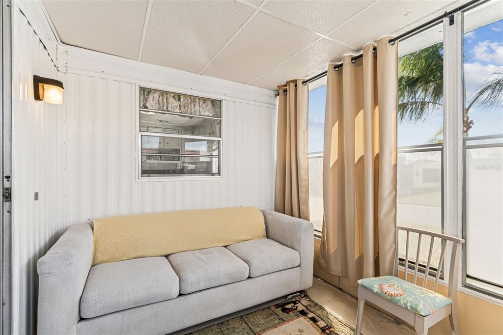 13225 101st Street Southeast, Unit 222 Largo, FL 33773 - Photo 31 of 73 a living room with furniture and a window