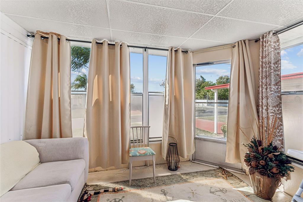 13225 101st Street Southeast, Unit 222 Largo, FL 33773 - Photo 32 of 73 a living room with furniture and a window