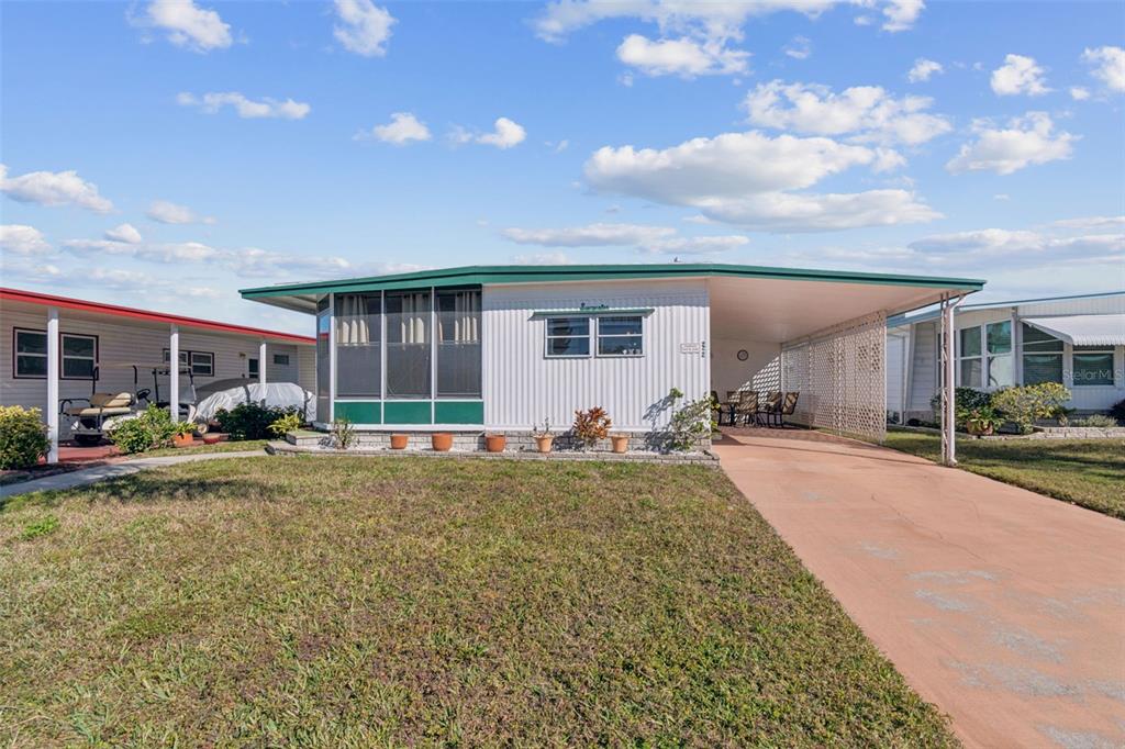 13225 101st Street Southeast, Unit 222 Largo, FL 33773 - Photo 4 of 73 a view of a house with backyard and porch