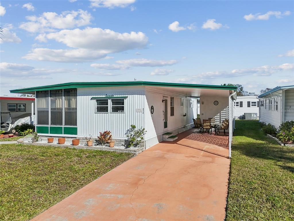 13225 101st Street Southeast, Unit 222 Largo, FL 33773 - Photo 50 of 73 a front view of a house with garden