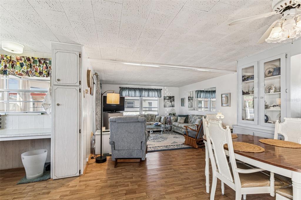 13225 101st Street Southeast, Unit 222 Largo, FL 33773 - Photo 9 of 73 a living room with furniture and a wooden floor
