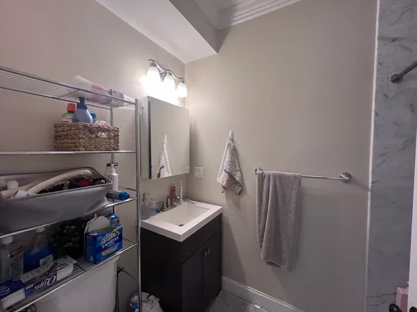 a bathroom with a sink and mirror