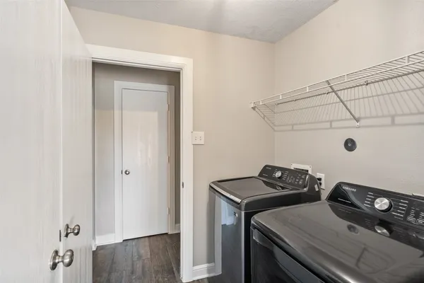a view of a storage and utility room with a sink