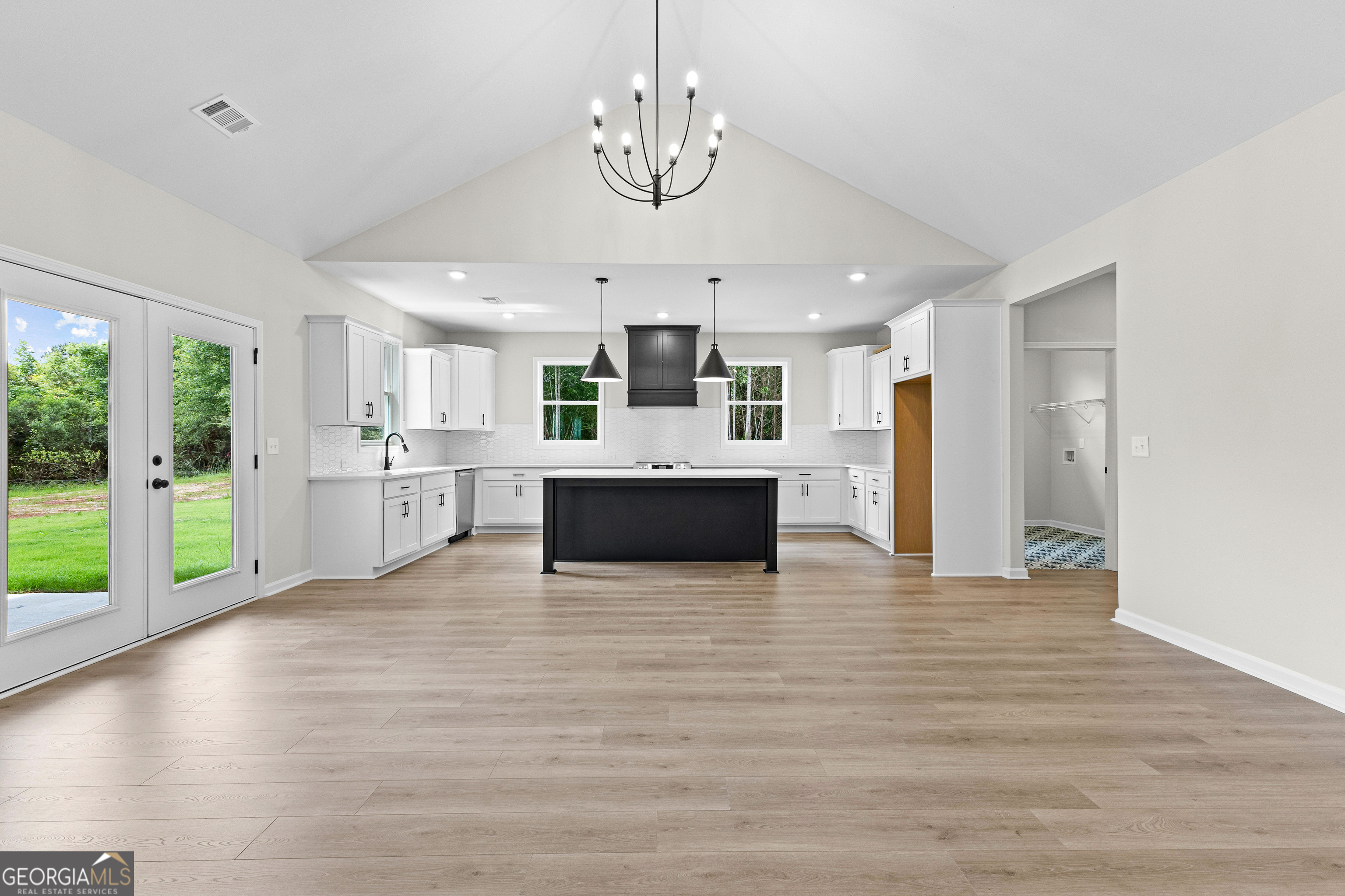1210 Waymanville Road Thomaston, GA 30286 - Photo 17 of 45 a view of a kitchen with a stove wooden cabinets and a kitchen
