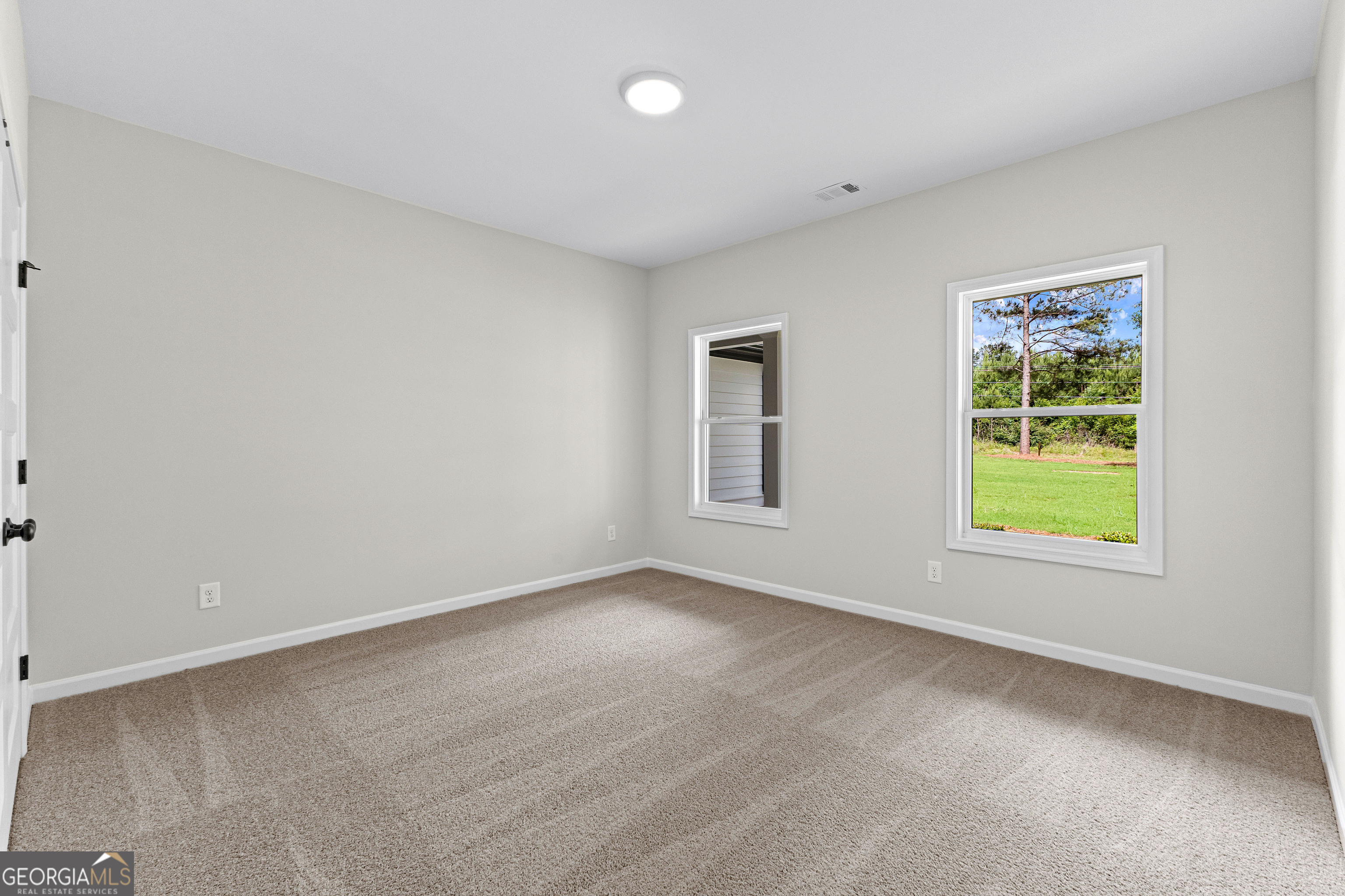 1210 Waymanville Road Thomaston, GA 30286 - Photo 23 of 45 an empty room with windows