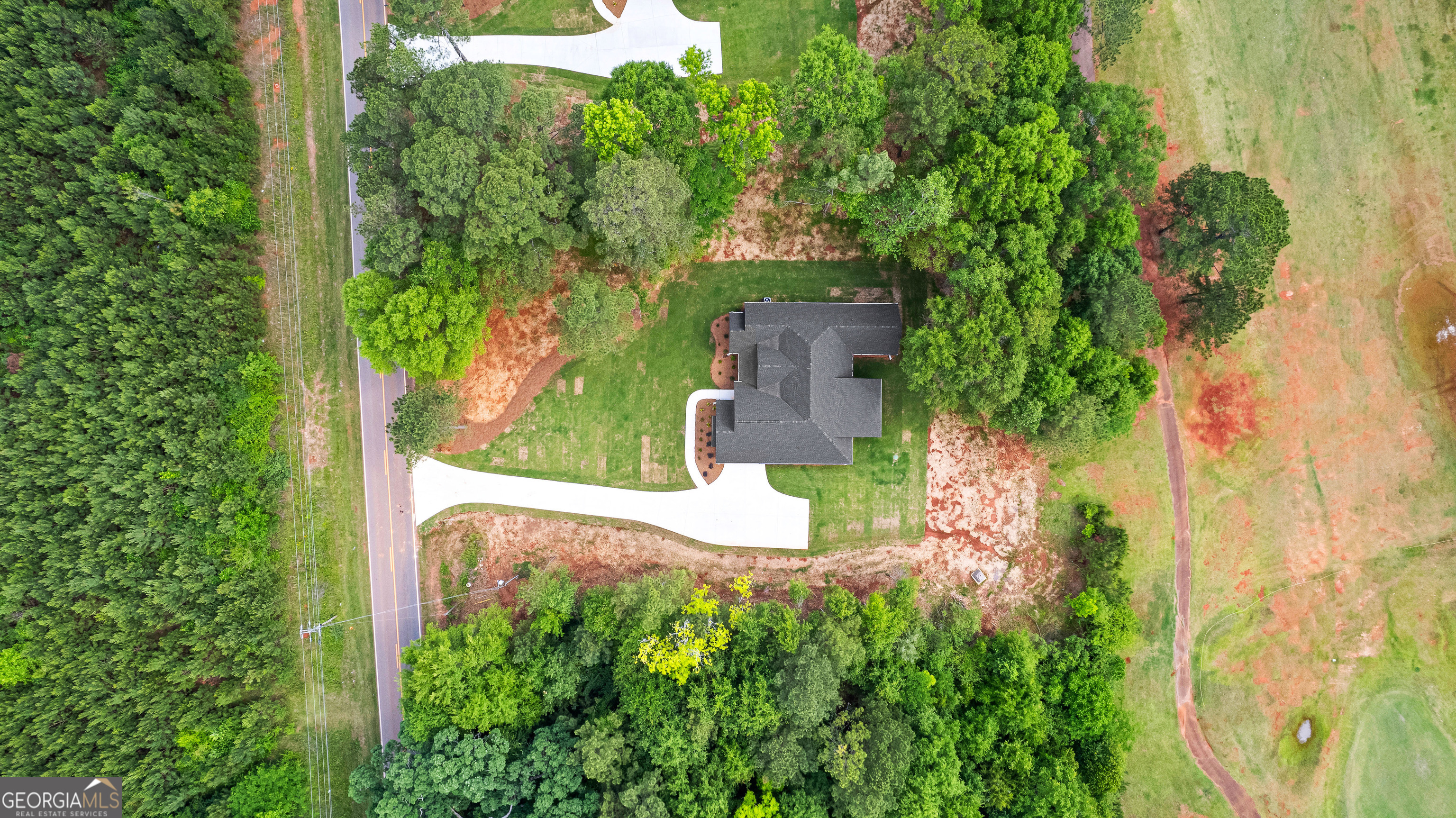 1210 Waymanville Road Thomaston, GA 30286 - Photo 3 of 45 an aerial view of a house with a yard and garden