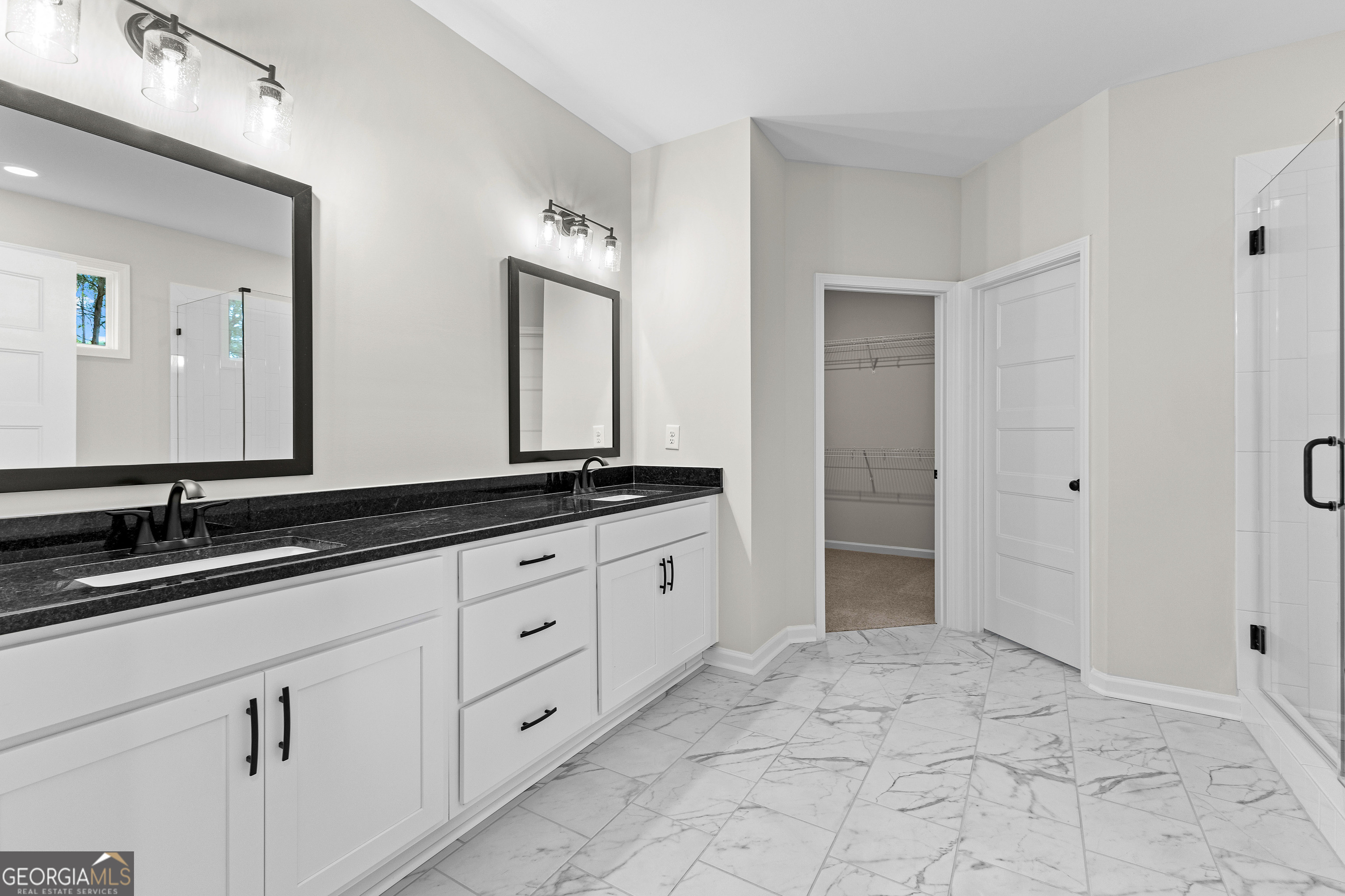 1210 Waymanville Road Thomaston, GA 30286 - Photo 36 of 45 a spacious bathroom with a granite countertop sink and a mirror