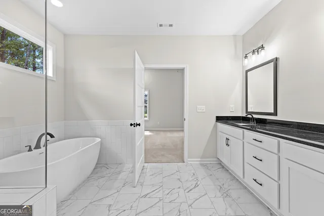 a view of a house with backyard and porch