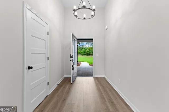 a view of bedroom with wooden floor