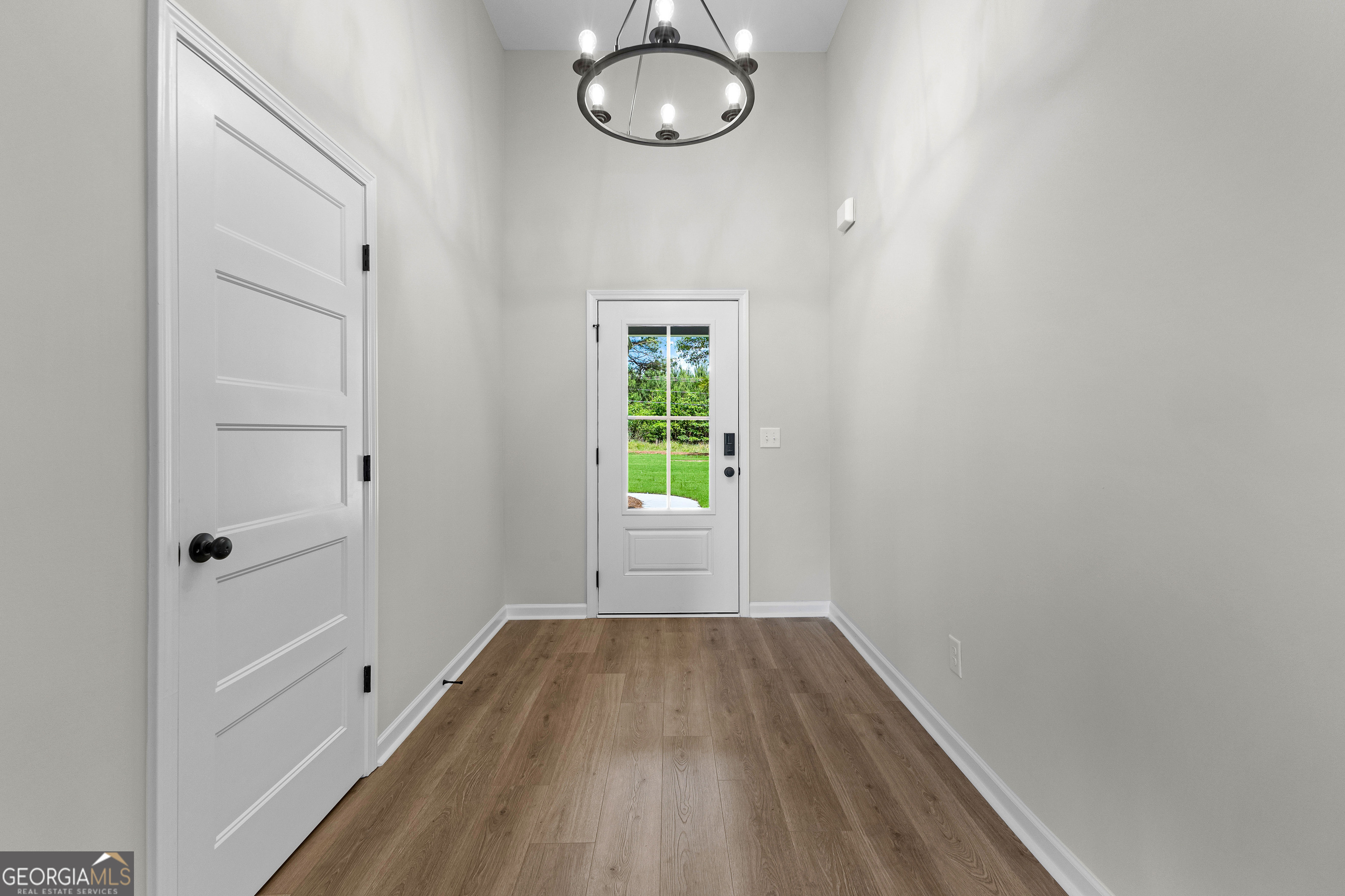 1210 Waymanville Road Thomaston, GA 30286 - Photo 9 of 45 a view of room with window and wooden floor