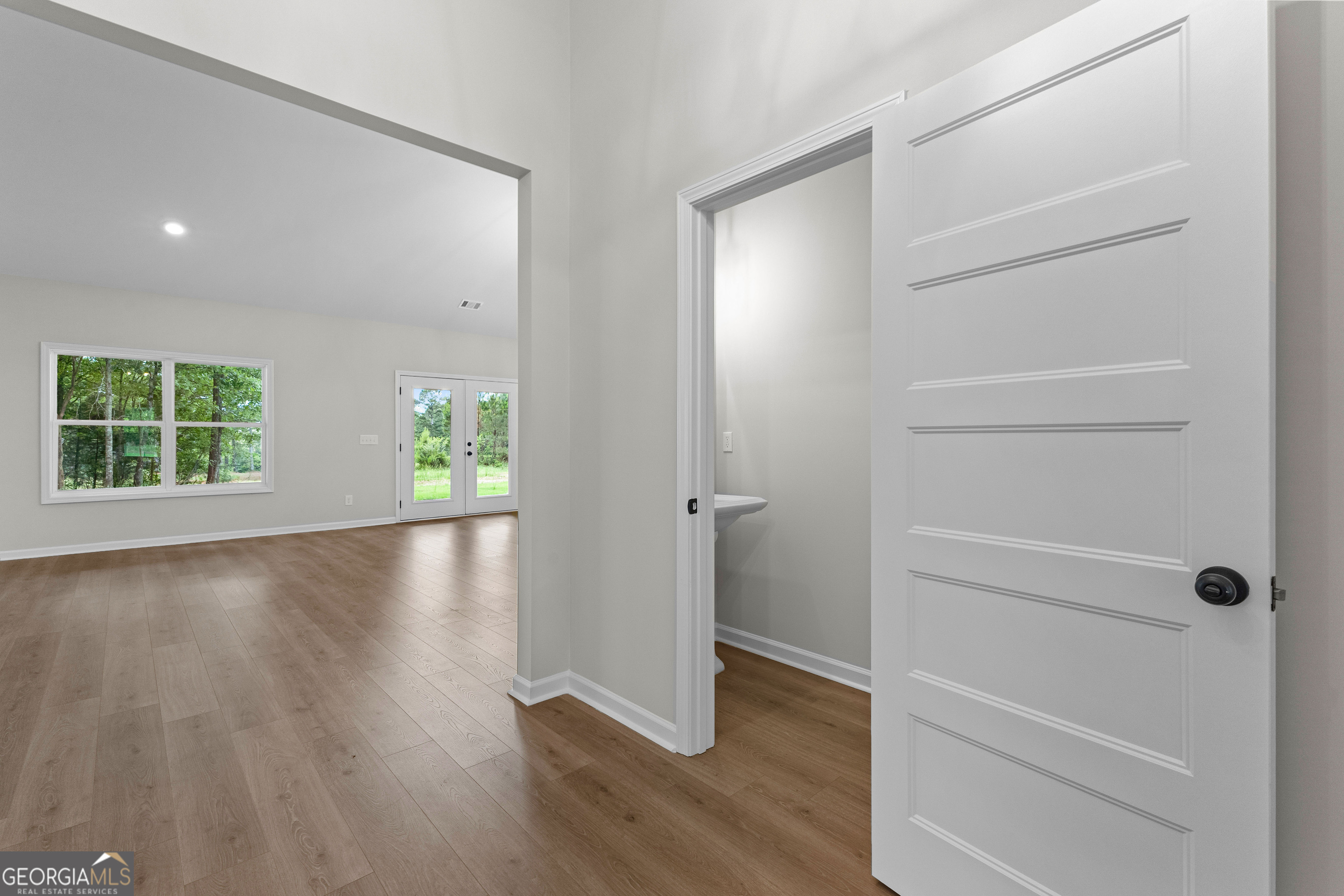 1210 Waymanville Road Thomaston, GA 30286 - Photo 10 of 45 wooden floor in an empty room with a window