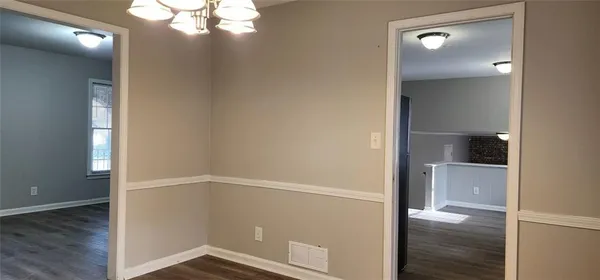 wooden floor in an empty room with a mirror