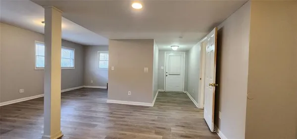 a bathroom with a granite countertop sink a toilet and a mirror