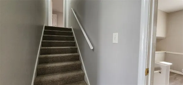 a view of a bathroom from a hallway