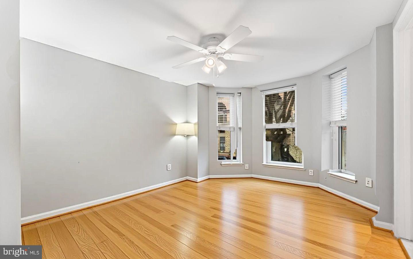 1124 25th Street Northwest, Unit T4 Washington, DC 20037 - Photo 11 of 21 a view of an empty room with window and wooden floor