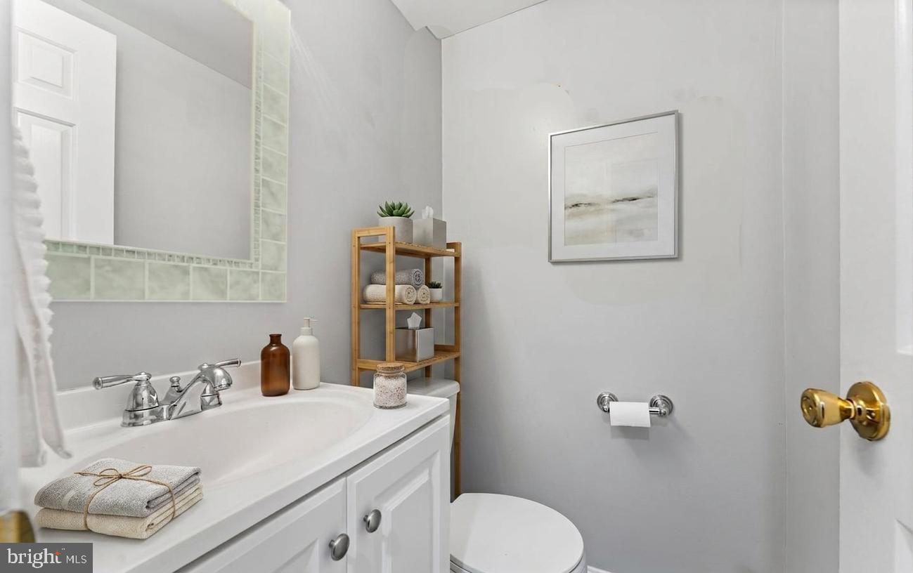 1124 25th Street Northwest, Unit T4 Washington, DC 20037 - Photo 8 of 21 a bathroom with a sink toilet and vanity