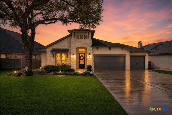 a front view of a house with a yard