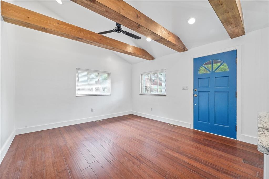 16 5th Street Carnegie, PA 15106 - Photo 11 of 31 a view of an empty room with wooden floor and a window