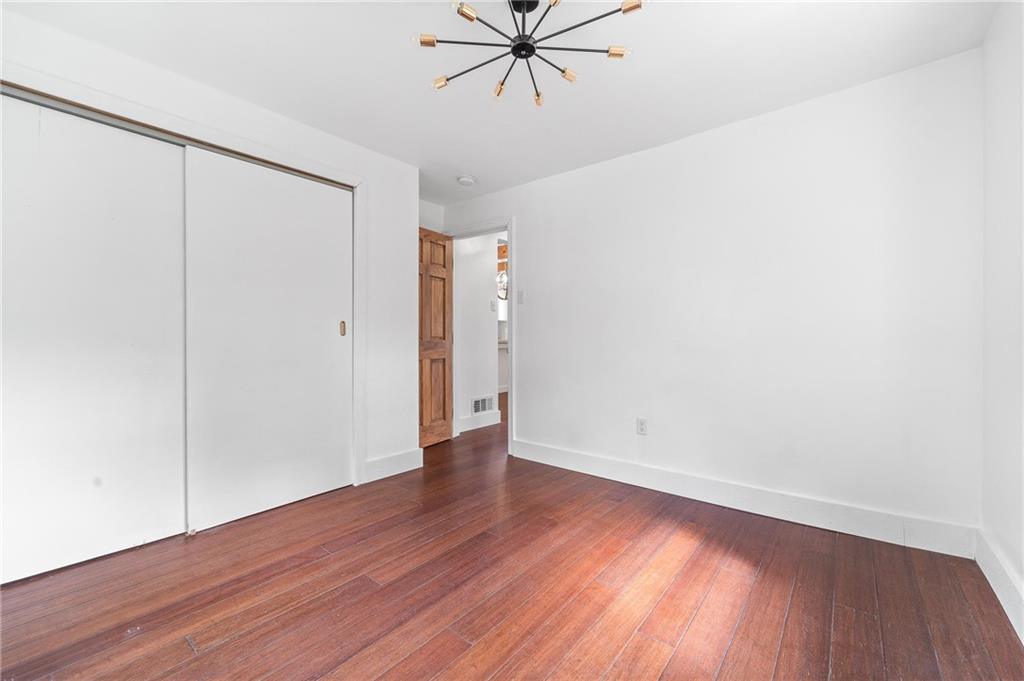 16 5th Street Carnegie, PA 15106 - Photo 12 of 31 a view of an empty room with wooden floor