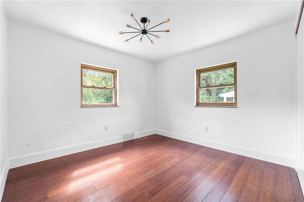16 5th Street Carnegie, PA 15106 - Photo 13 of 31 a view of empty room with wooden floor and fan