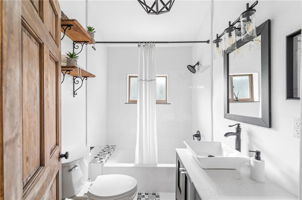 16 5th Street Carnegie, PA 15106 - Photo 16 of 31 a bathroom with a sink toilet a mirror and shower