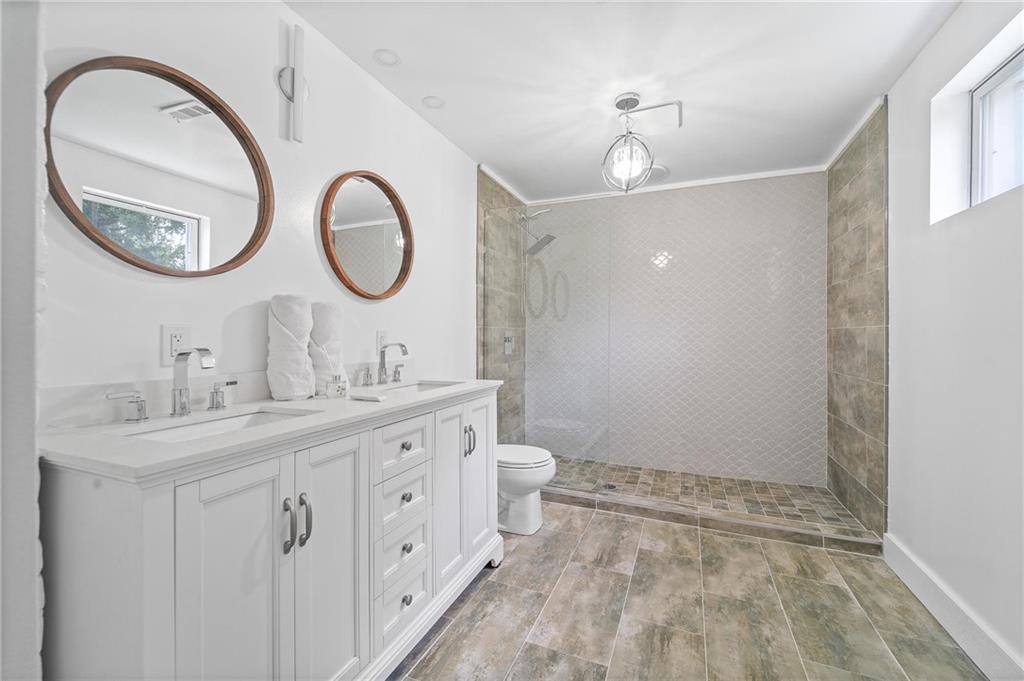 16 5th Street Carnegie, PA 15106 - Photo 19 of 31 a bathroom with 2 sink and a mirror