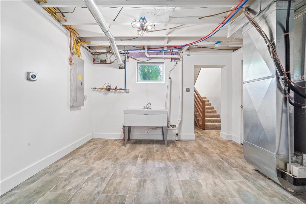 16 5th Street Carnegie, PA 15106 - Photo 23 of 31 a view of a room with wooden walls and stairs