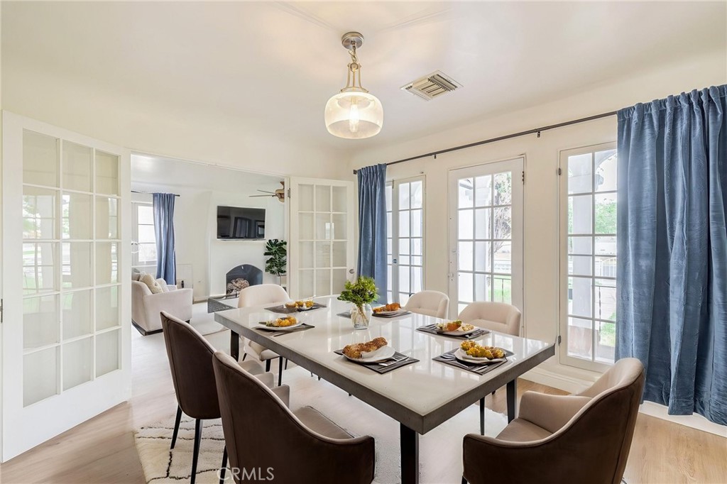 44603 Fig Avenue Lancaster, CA 93534 - Photo 18 of 39 a view of a dining room with furniture window and wooden floor