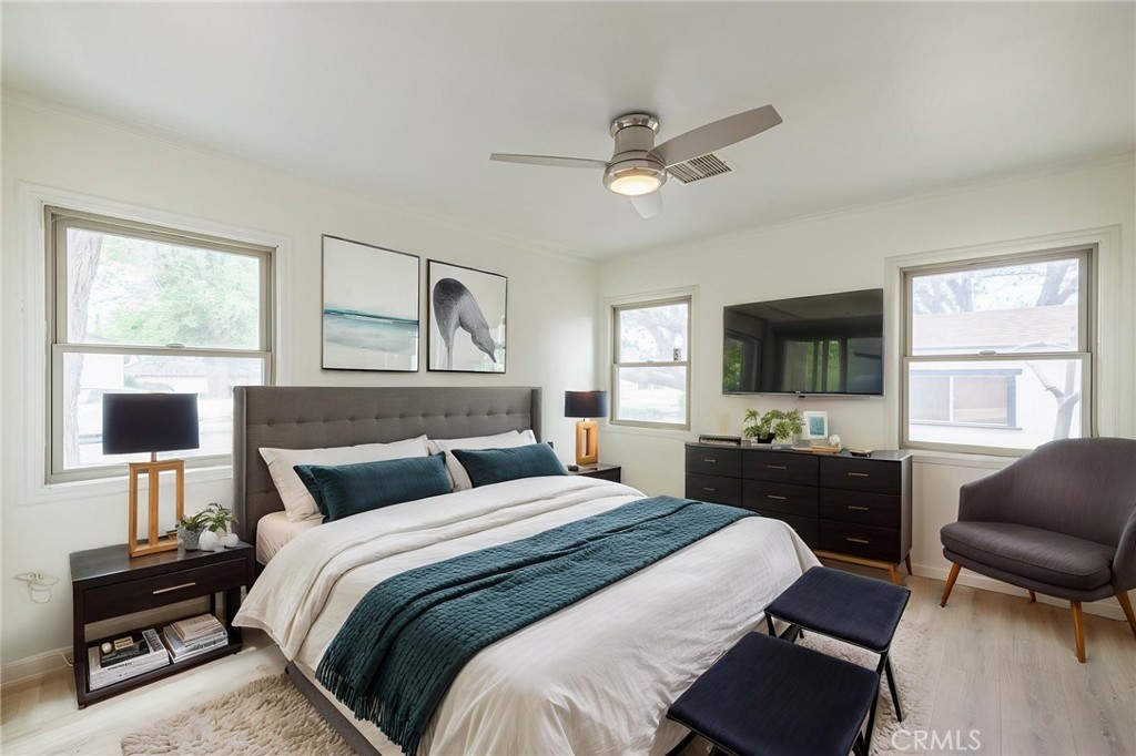 44603 Fig Avenue Lancaster, CA 93534 - Photo 22 of 39 a bedroom with a bed and a flat screen tv