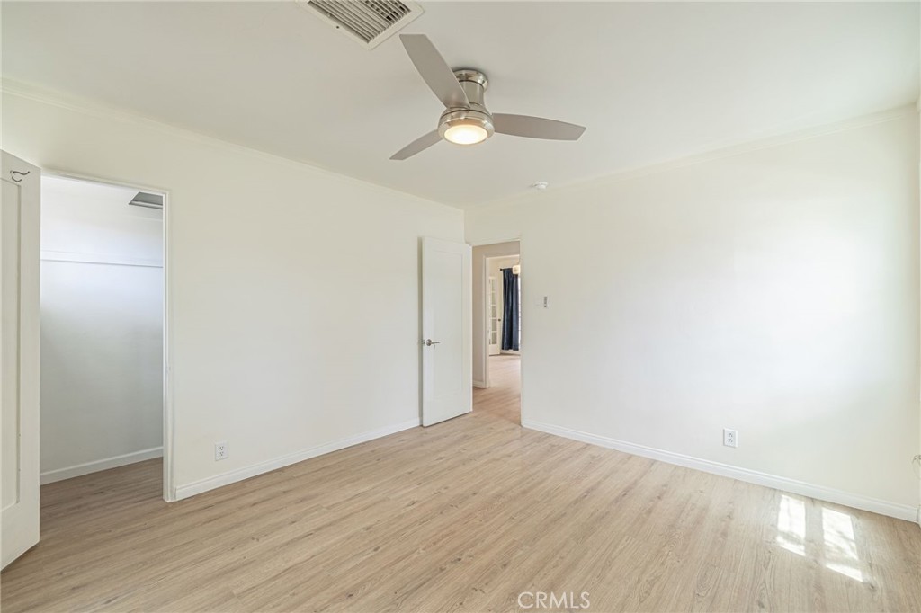 44603 Fig Avenue Lancaster, CA 93534 - Photo 24 of 39 a view of an empty room with wooden floor