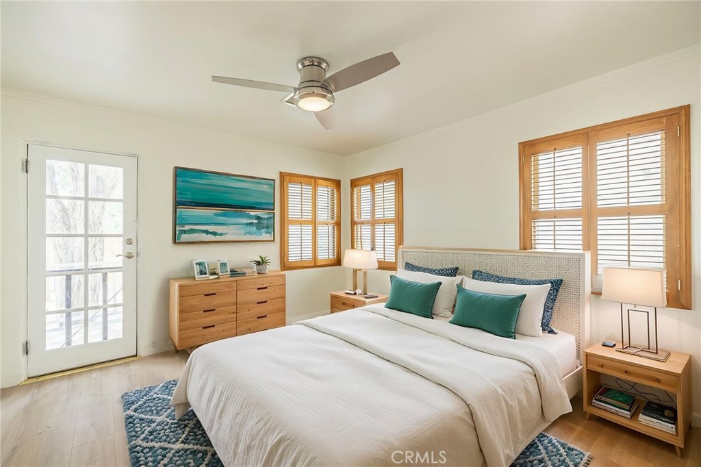 44603 Fig Avenue Lancaster, CA 93534 - Photo 26 of 39 a bedroom with a bed and a dresser with mirror