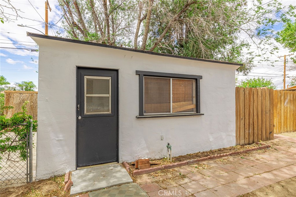 44603 Fig Avenue Lancaster, CA 93534 - Photo 32 of 39 a view of a house with a backyard