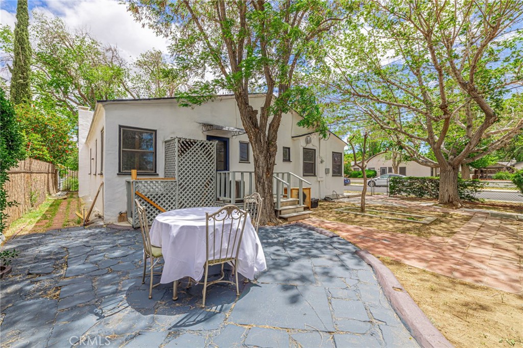 44603 Fig Avenue Lancaster, CA 93534 - Photo 35 of 39 a view of a patio with a chairs and table in the patio