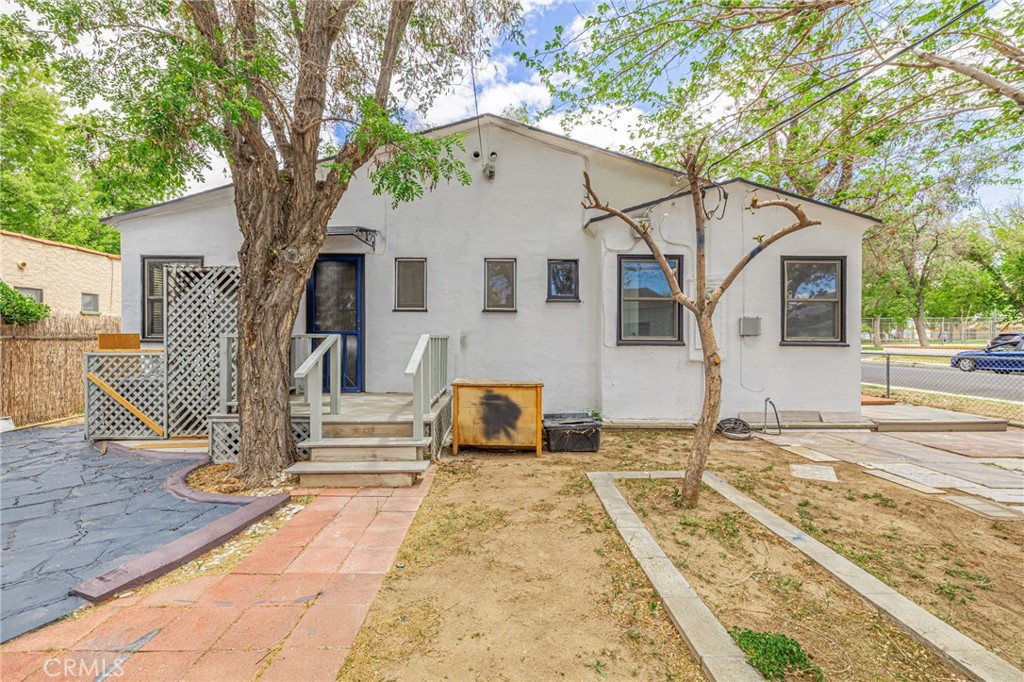 44603 Fig Avenue Lancaster, CA 93534 - Photo 36 of 39 a front view of a house with a yard