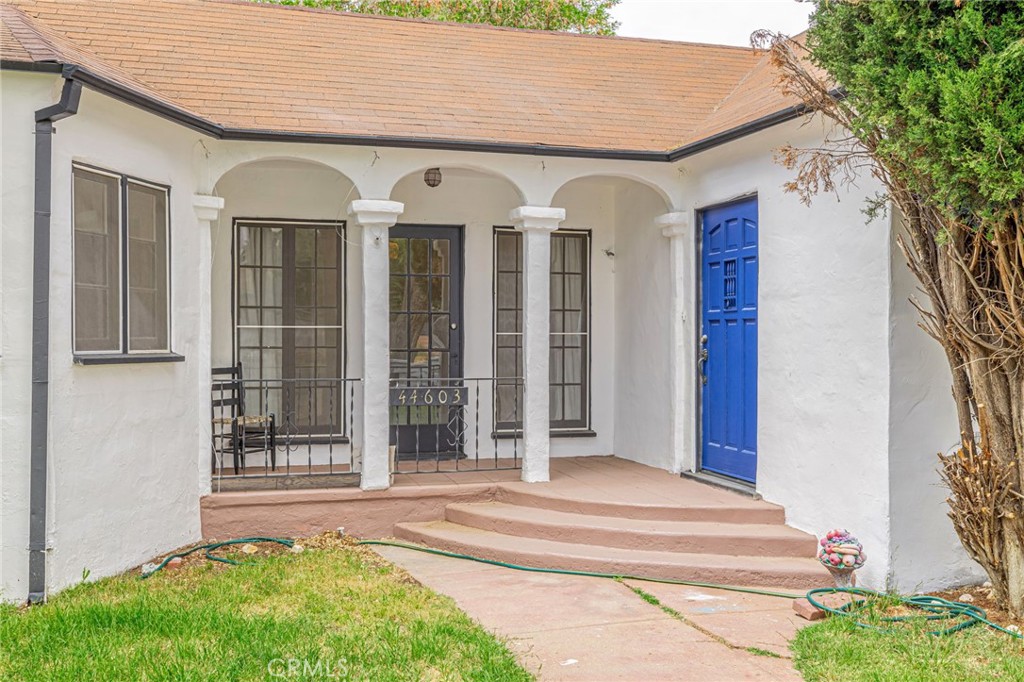 44603 Fig Avenue Lancaster, CA 93534 - Photo 7 of 39 a view of a house with a porch