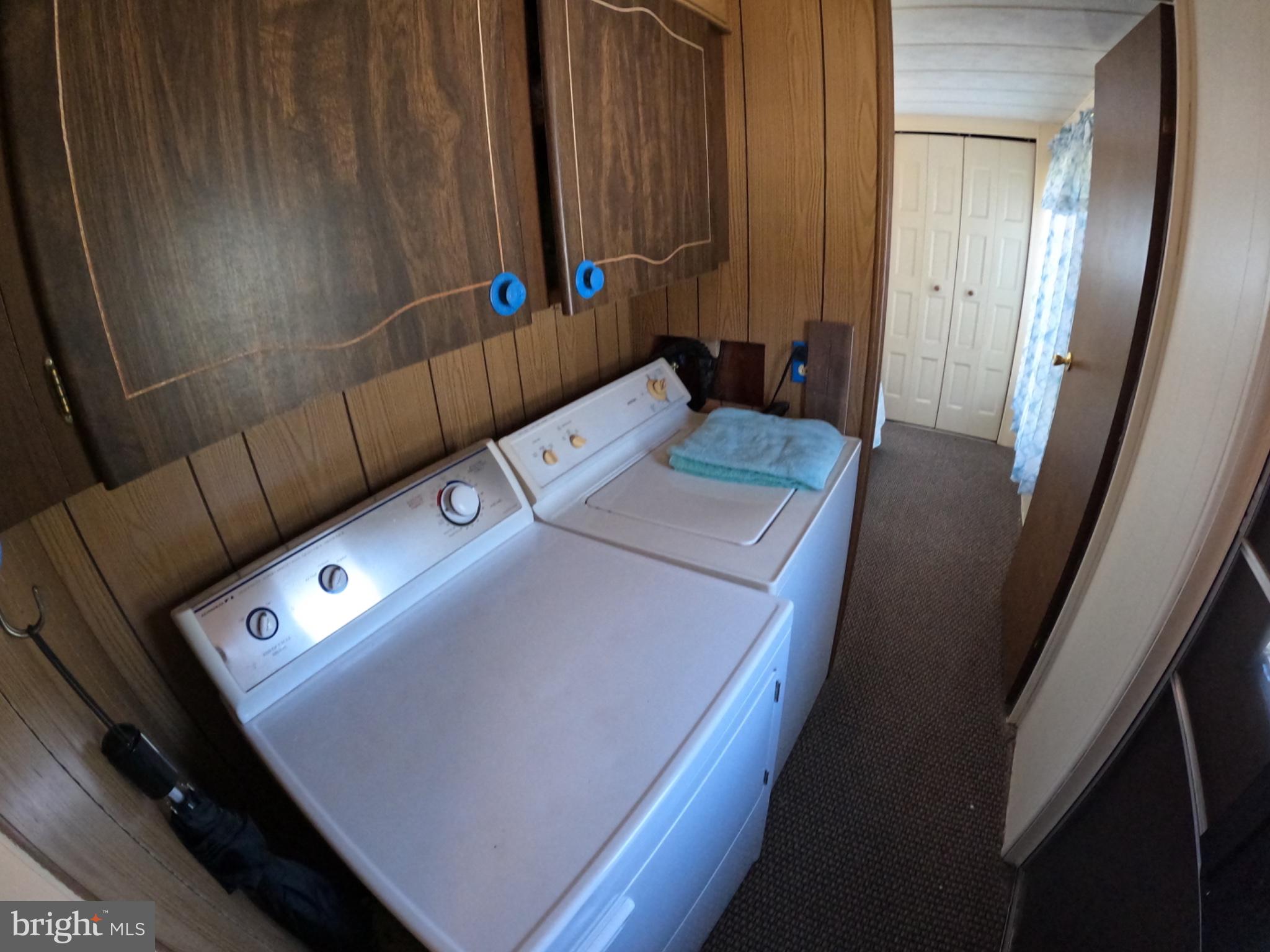 163 Clamshell Road Ocean City, MD 21842 - Photo 11 of 18 a utility room with dryer and washer