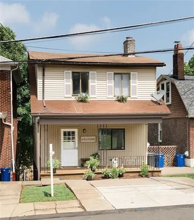 a front view of a house with a porch
