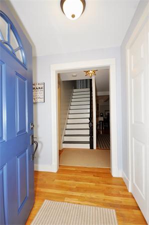 1 1/2 Great Road Maynard, MA 01754 - Photo 3 of 26 a view of a livingroom with wooden floor and staircase
