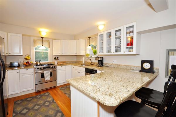 1 1/2 Great Road Maynard, MA 01754 - Photo 6 of 26 a kitchen with stainless steel appliances granite countertop a sink stove and refrigerator