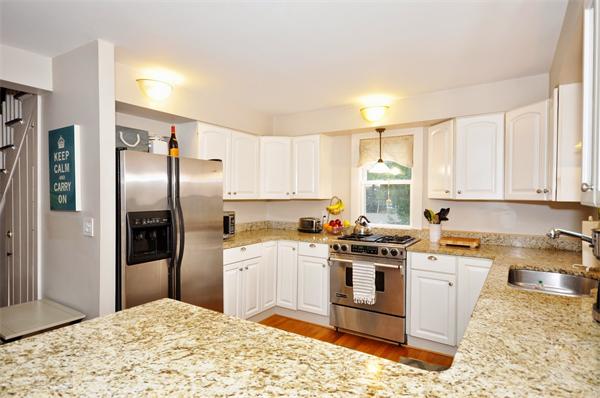 1 1/2 Great Road Maynard, MA 01754 - Photo 8 of 26 a kitchen with granite countertop a refrigerator stove top oven and sink