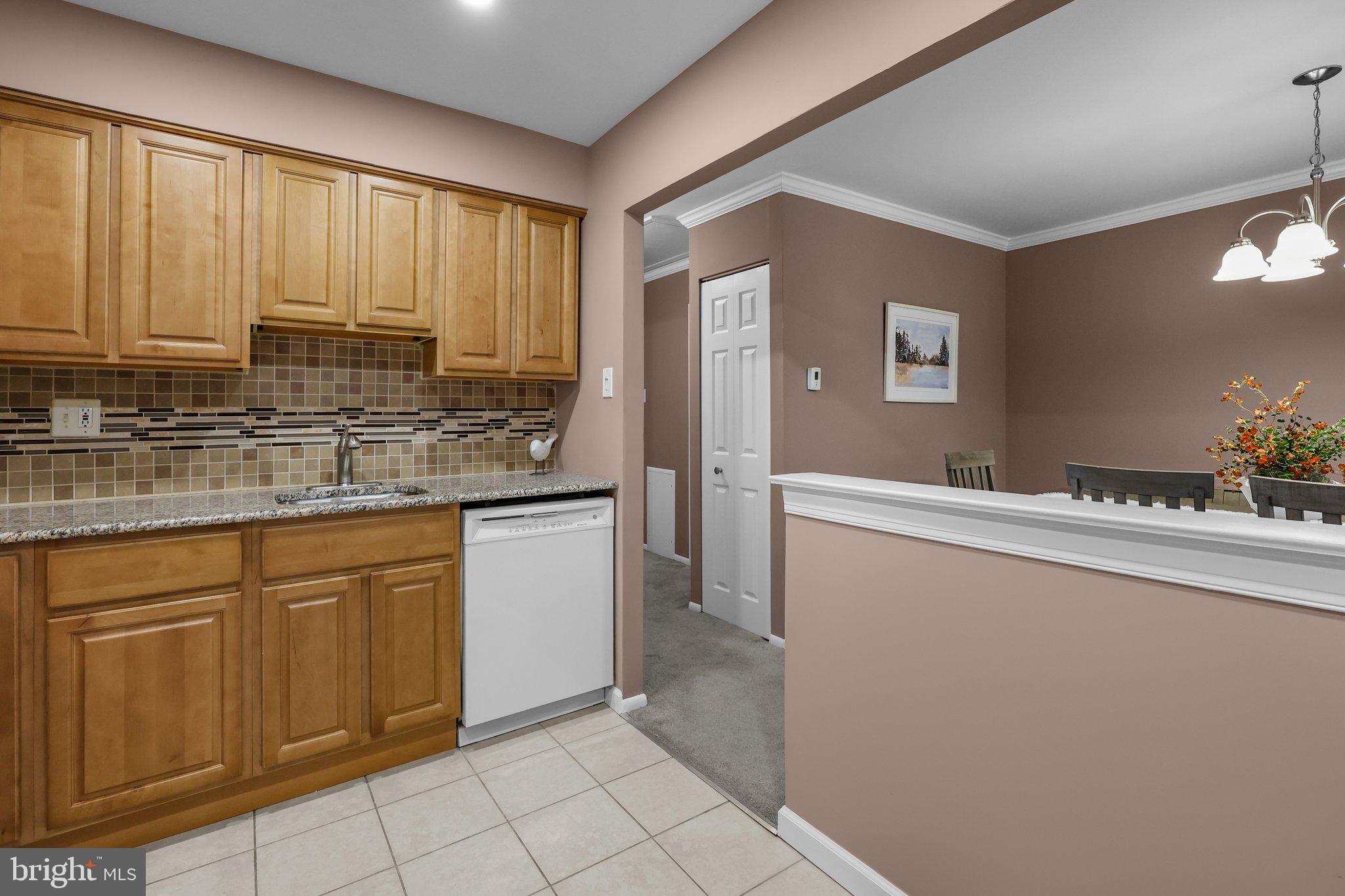 185 Greendale Road Philadelphia, PA 19154 - Photo 11 of 26 a kitchen with stainless steel appliances granite countertop a sink and cabinets
