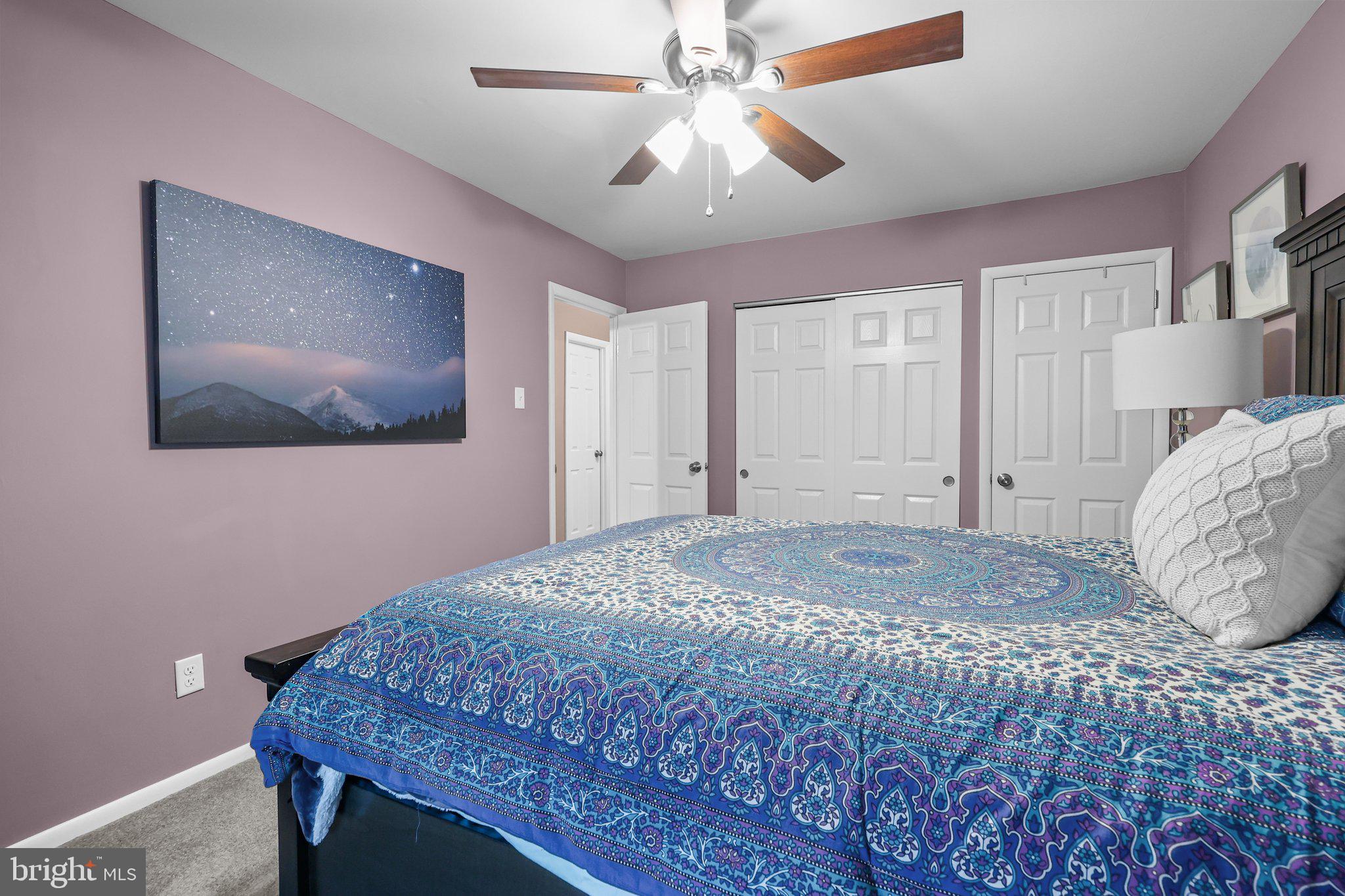 185 Greendale Road Philadelphia, PA 19154 - Photo 15 of 26 a bedroom with a bed and a painting on the wall