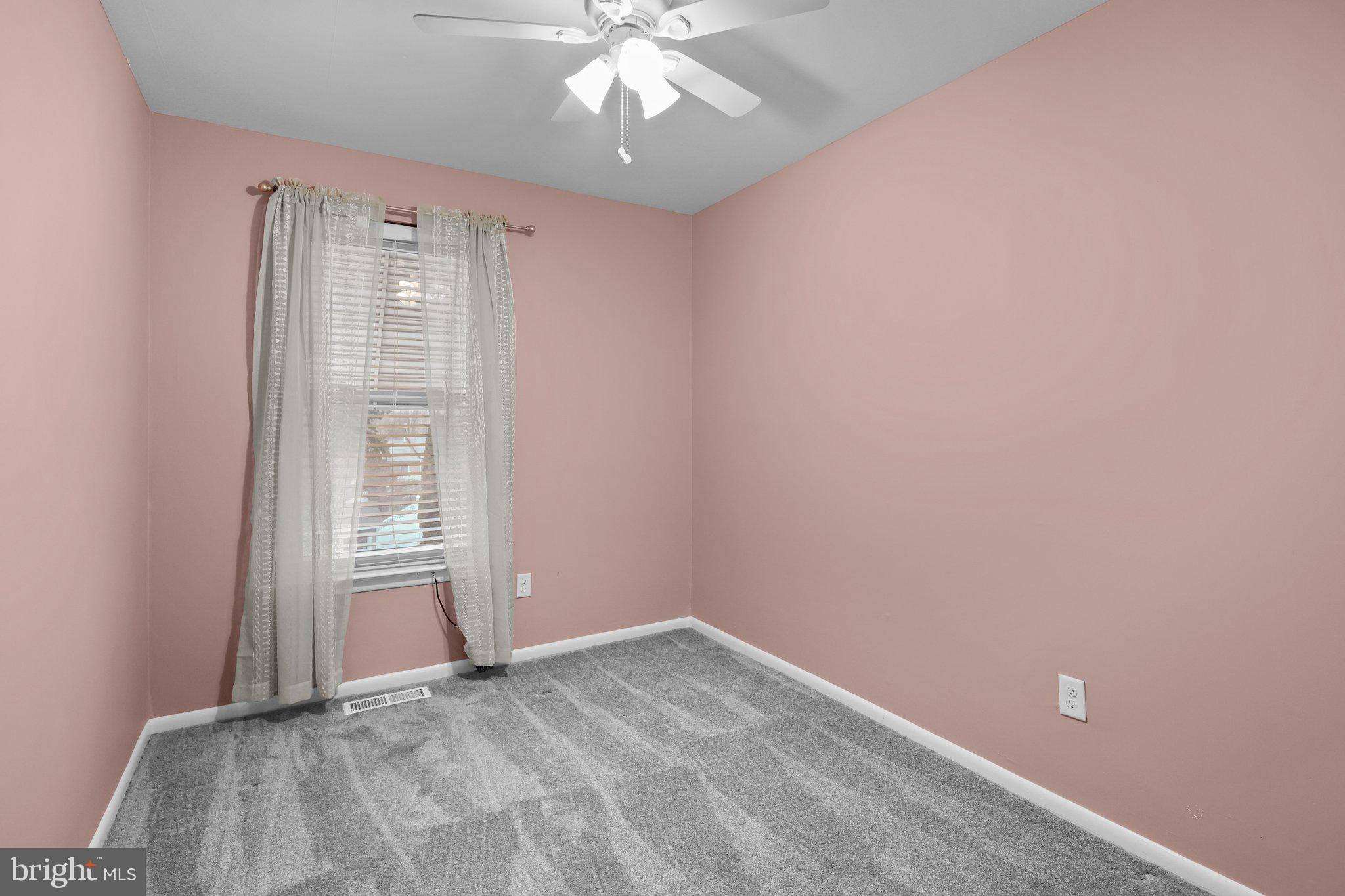 185 Greendale Road Philadelphia, PA 19154 - Photo 16 of 26 an empty room with windows and fan