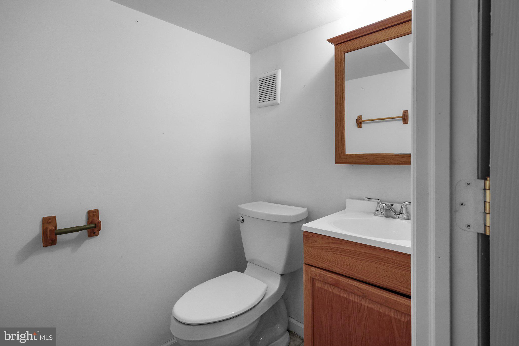 185 Greendale Road Philadelphia, PA 19154 - Photo 22 of 26 a white toilet sitting next to a bathroom sink