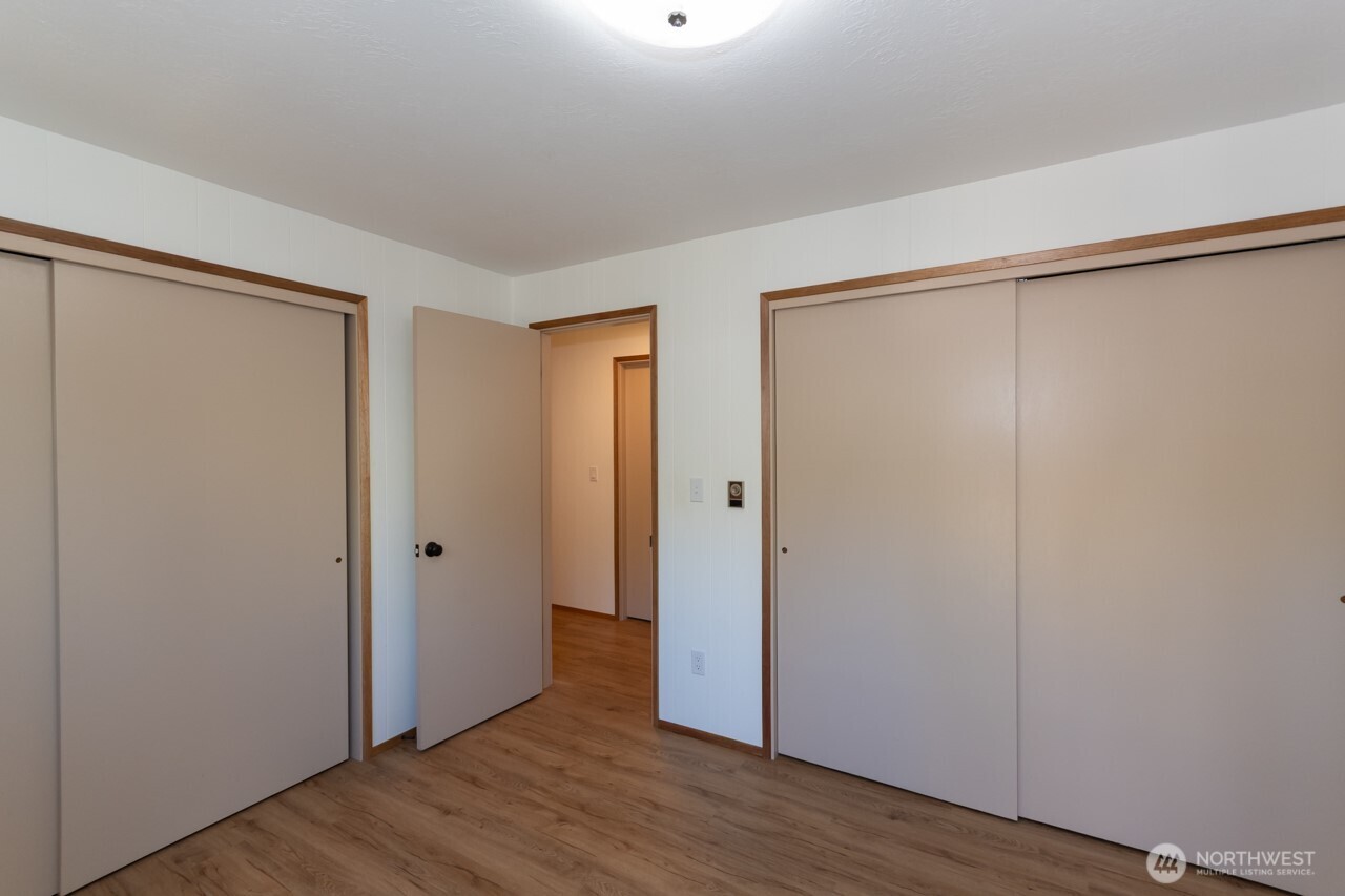 63 East Arnette Road Port Angeles, WA 98362 - Photo 24 of 40 a view of an empty room with wooden floor