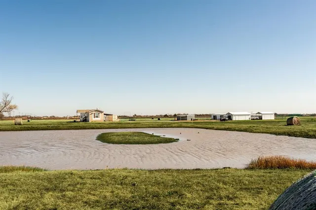 a view of a lake with houses in the background